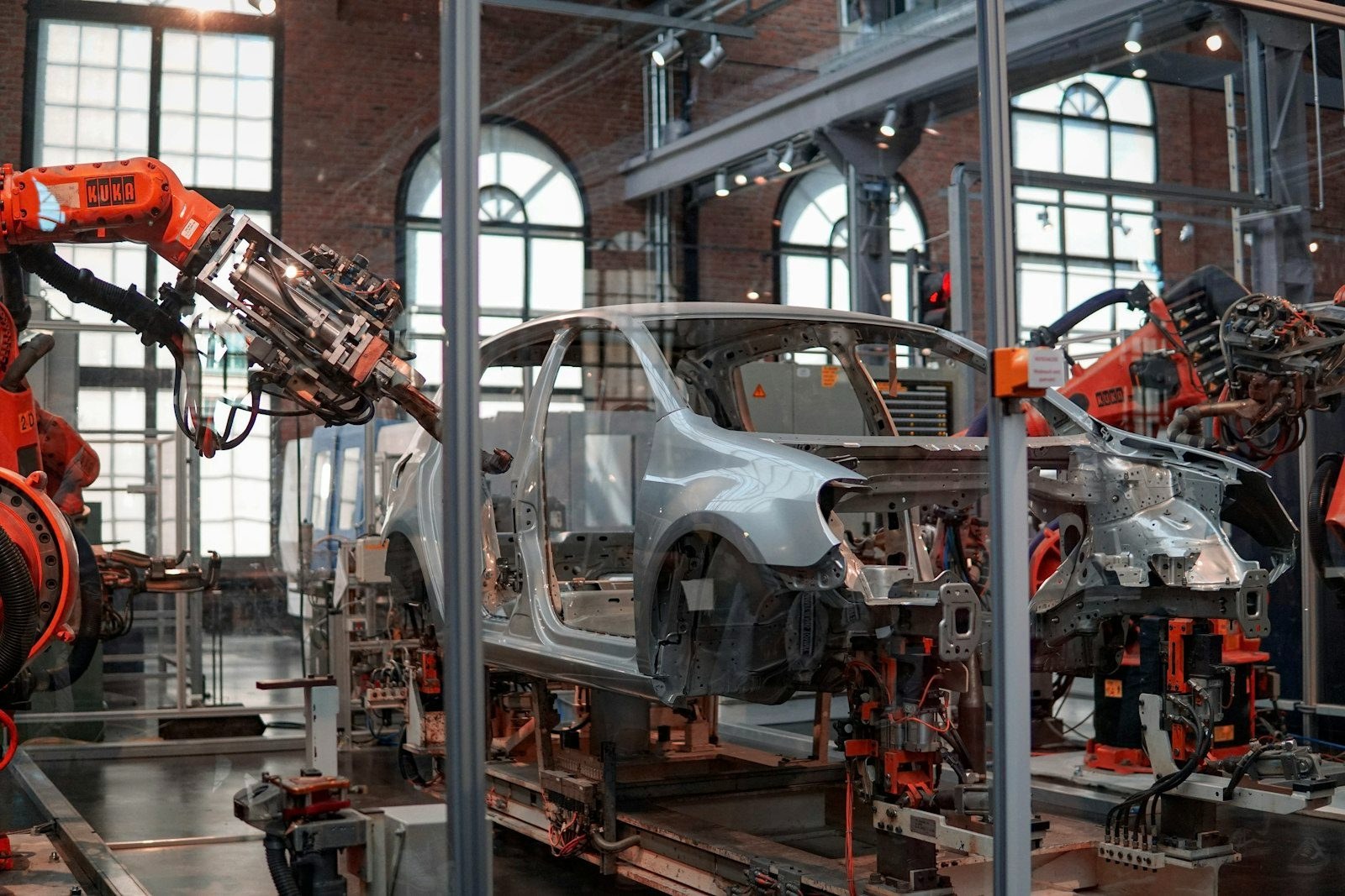 Robotic arms welding a vehicle body on an assembly line