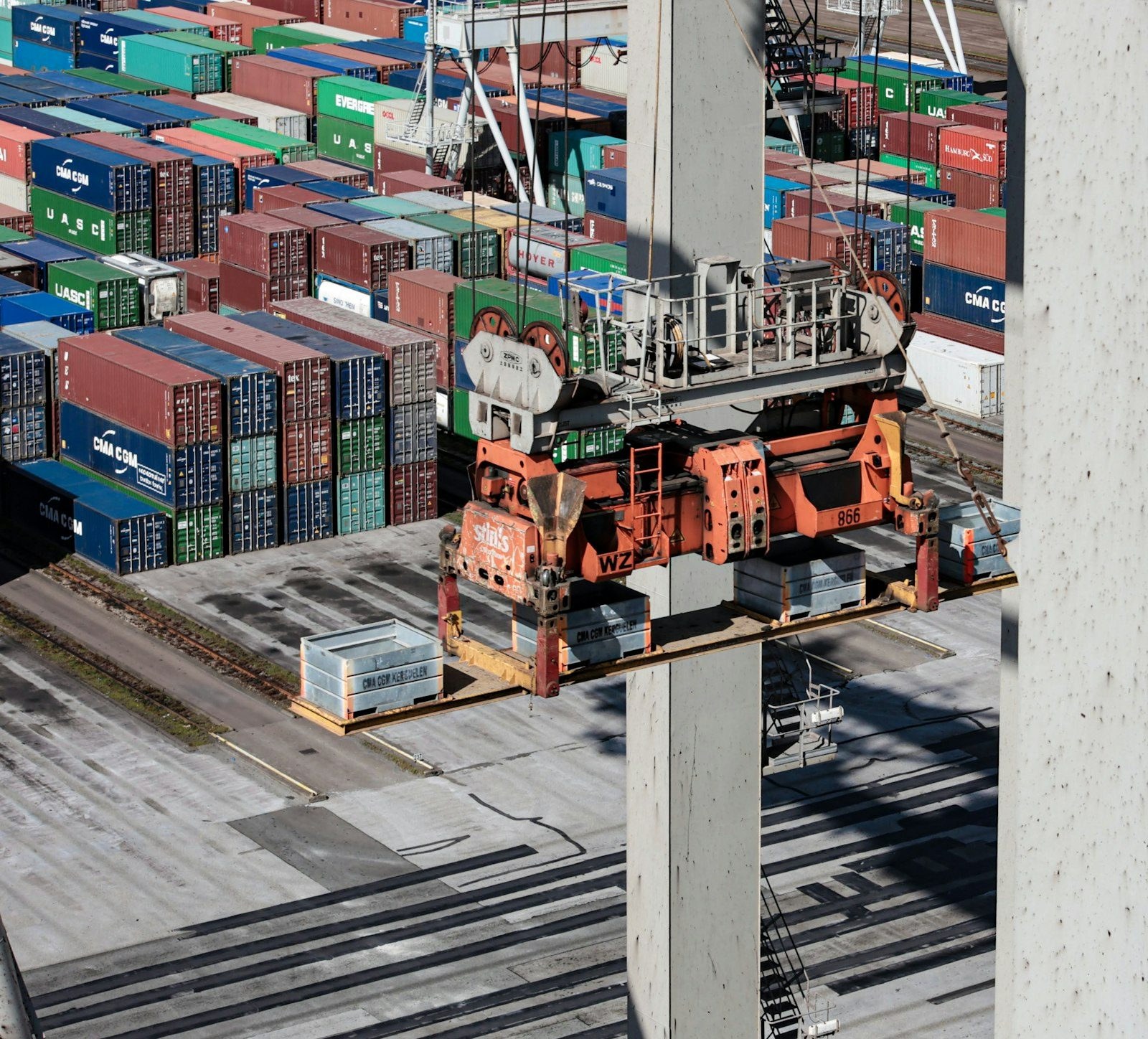 Stacked containers and a gantry crane at the Maasvlakte terminal, Port of Rotterdam